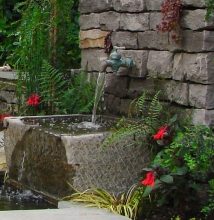 Stone basin trough as traditional garden feature